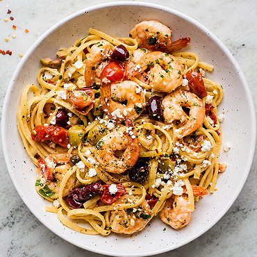 Saucy Greek Baked Shrimp Over Lemon Linguine